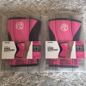 Two Rehband pink knee sleeves